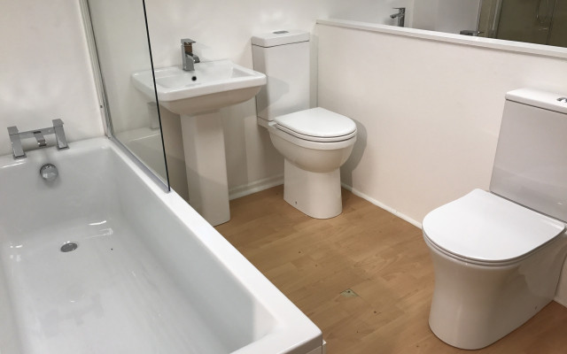 Bathroom showroom white suite